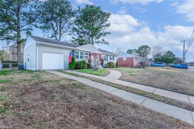 ranch-style home featuring a garage, central AC, fence, and concrete driveway