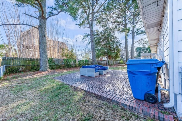 view of yard with a fenced backyard, a patio, and an outdoor living space