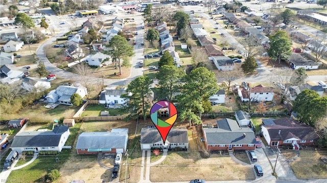 birds eye view of property with a residential view