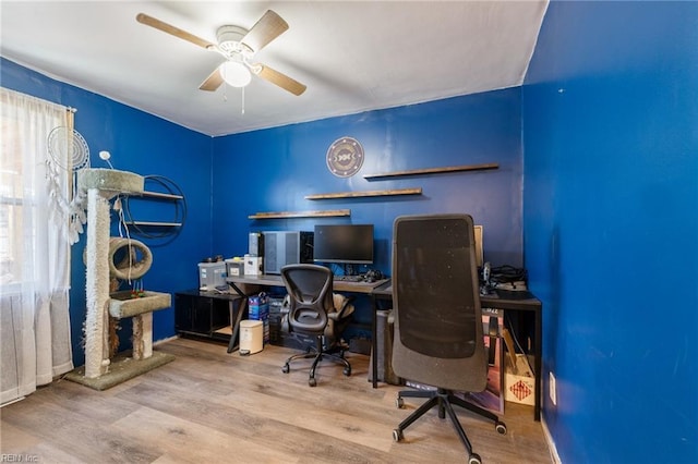 home office featuring a ceiling fan and wood finished floors