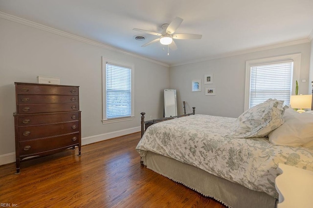 bedroom featuring a ceiling fan, crown molding, baseboards, and dark wood-style flooring