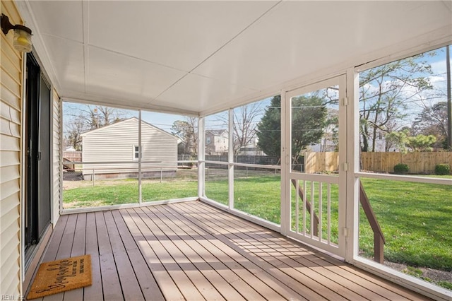 unfurnished sunroom featuring a healthy amount of sunlight