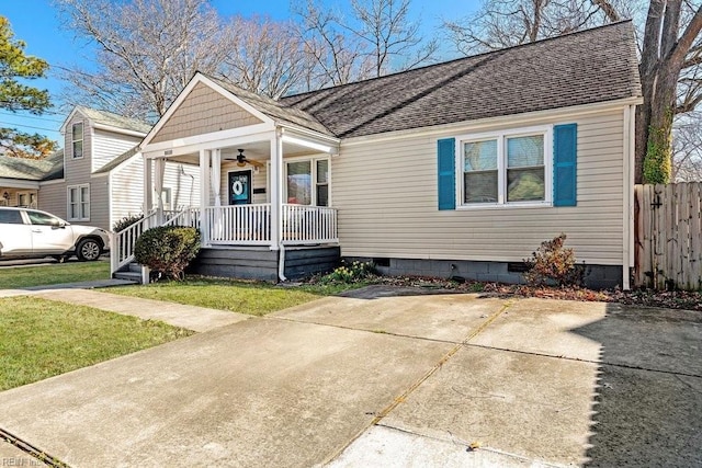 bungalow-style home with ceiling fan, a porch, a shingled roof, fence, and crawl space