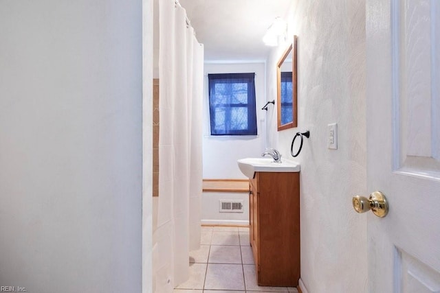 bathroom featuring vanity, curtained shower, tile patterned flooring, and visible vents