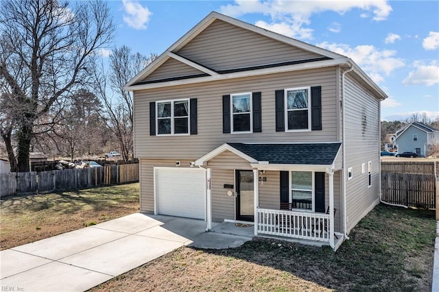 traditional-style house with driveway, a porch, an attached garage, fence, and a front lawn