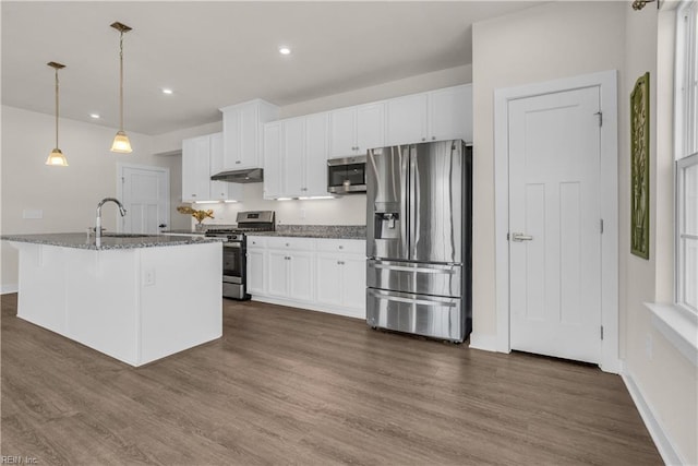 kitchen featuring dark wood-style floors, stainless steel appliances, white cabinets, a sink, and under cabinet range hood