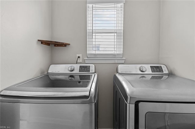 washroom with laundry area and separate washer and dryer