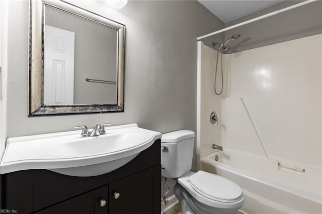 bathroom with vanity, bathing tub / shower combination, and toilet