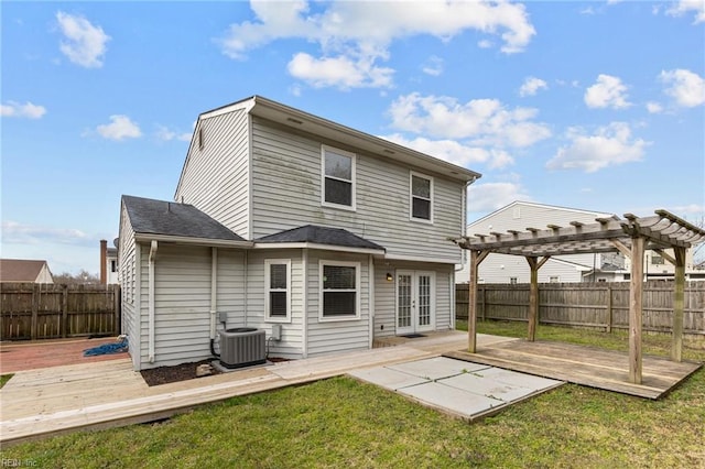 rear view of house featuring a fenced backyard, a pergola, french doors, a deck, and central air condition unit