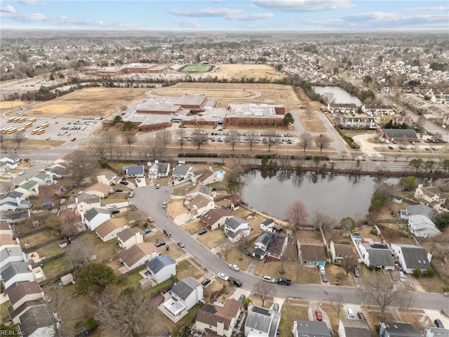 birds eye view of property featuring a residential view and a water view