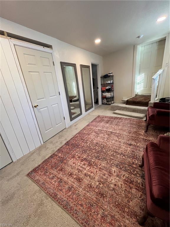 interior space featuring carpet flooring and recessed lighting