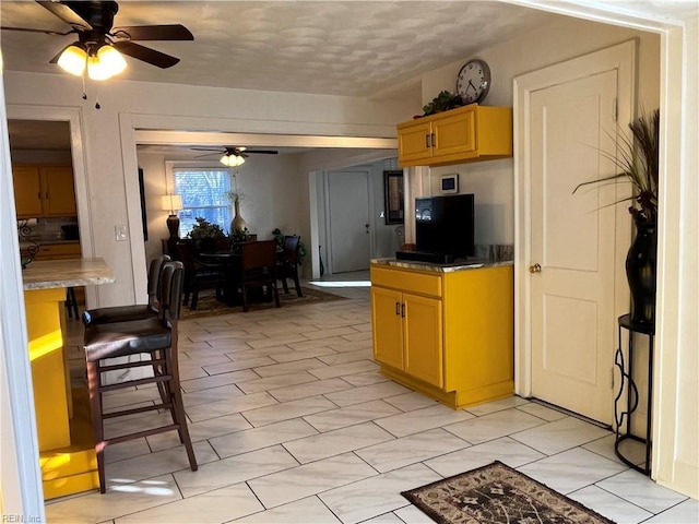 kitchen featuring a ceiling fan