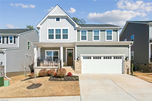 craftsman-style house featuring a porch, brick siding, driveway, and a garage