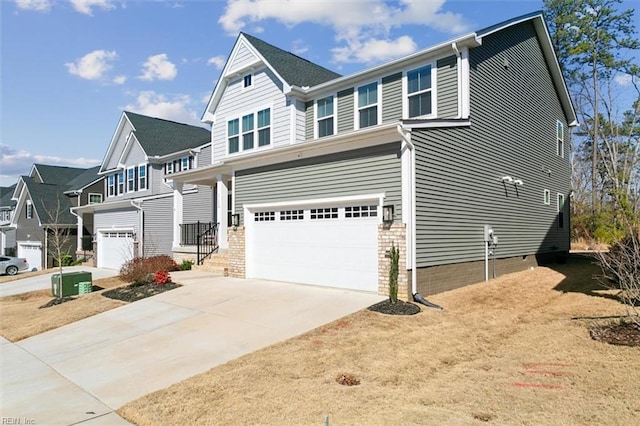 craftsman-style house with a residential view, concrete driveway, and an attached garage