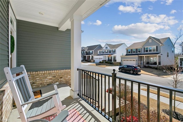 balcony featuring a porch and a residential view