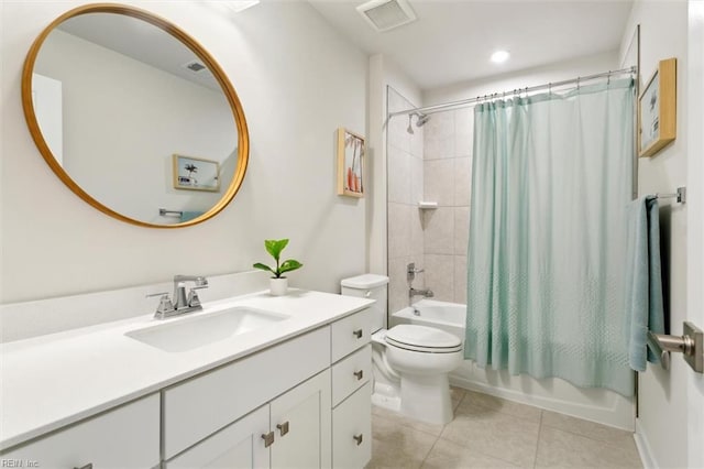 full bathroom featuring visible vents, toilet, shower / tub combo, vanity, and tile patterned floors