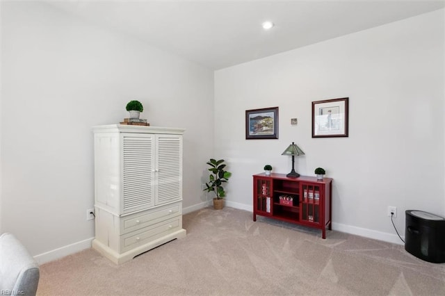 sitting room with carpet floors and baseboards