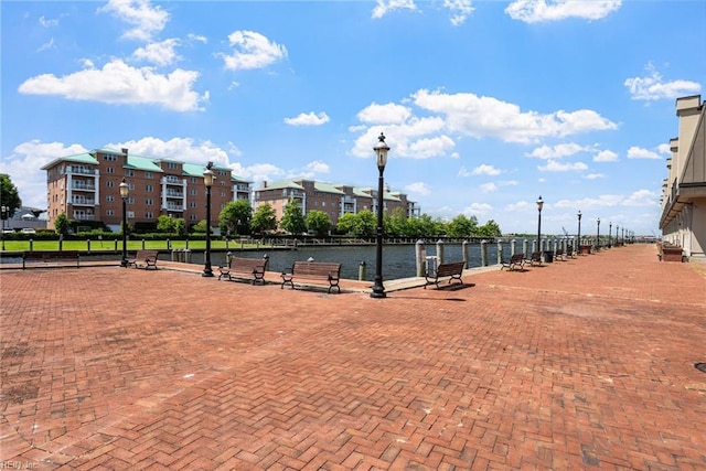 surrounding community featuring a water view