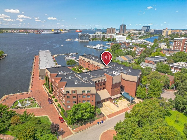 drone / aerial view featuring a water view and a view of city