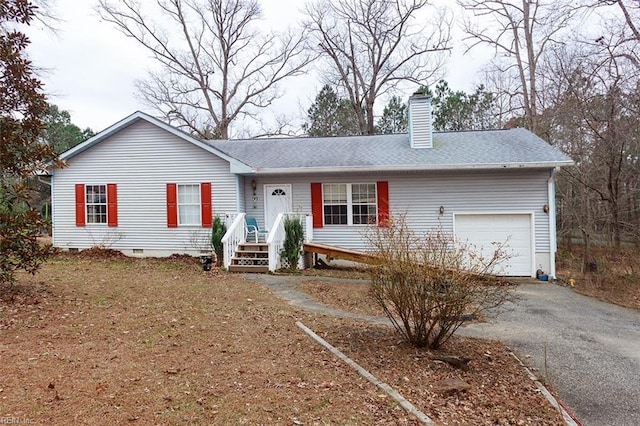 ranch-style home featuring aphalt driveway, a garage, a shingled roof, crawl space, and a chimney