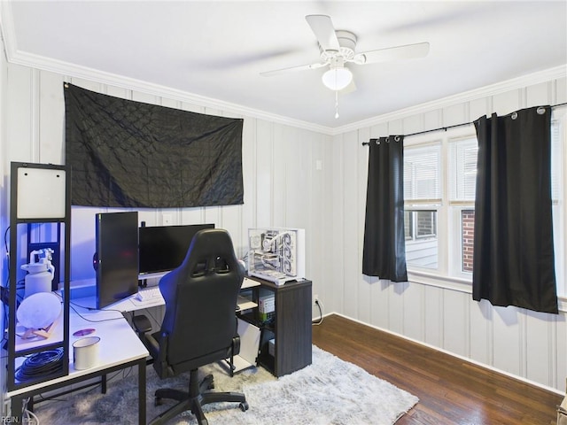 office space with a ceiling fan, ornamental molding, and wood finished floors