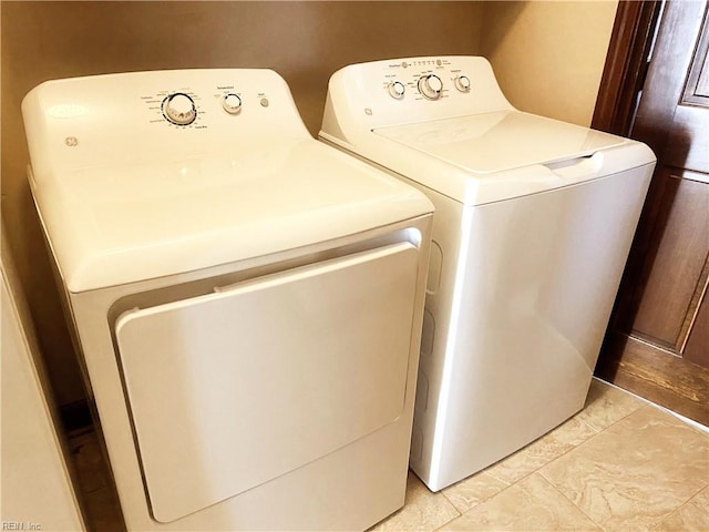 laundry area with laundry area and separate washer and dryer