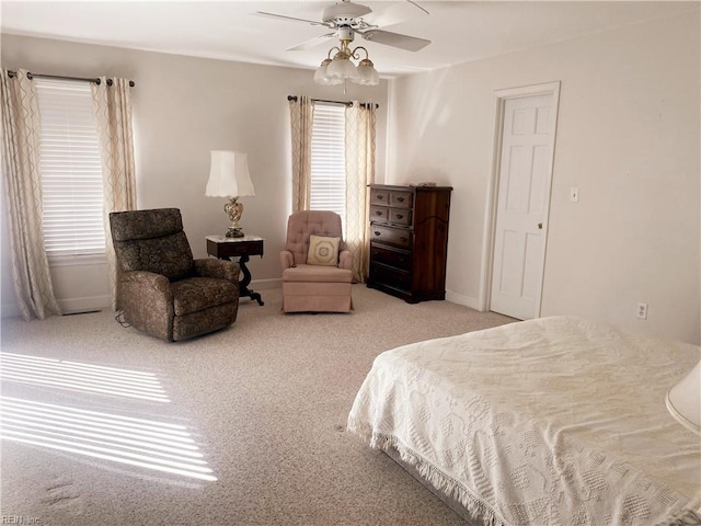 bedroom with carpet flooring, a ceiling fan, and baseboards