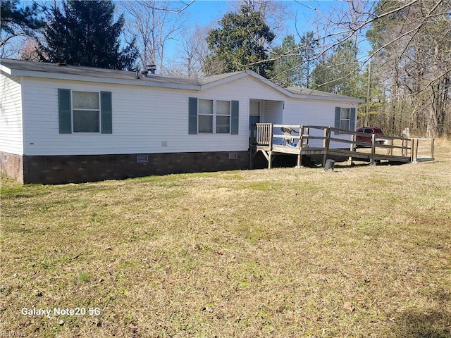 manufactured / mobile home with crawl space, a front lawn, and a wooden deck