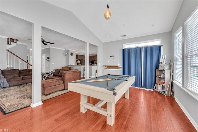 rec room with visible vents, a ceiling fan, vaulted ceiling, wood finished floors, and billiards