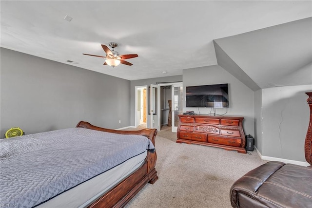 carpeted bedroom with a ceiling fan, visible vents, and baseboards