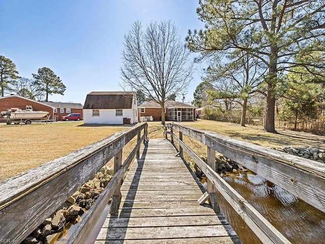 dock area featuring a yard