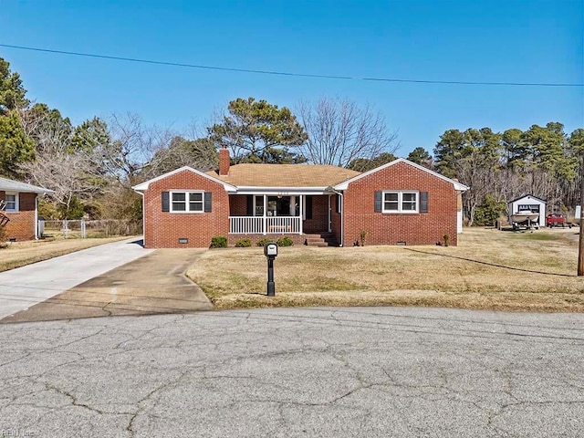 view of front of property with a porch, brick siding, concrete driveway, crawl space, and a chimney