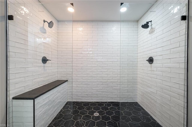 bathroom featuring a tile shower