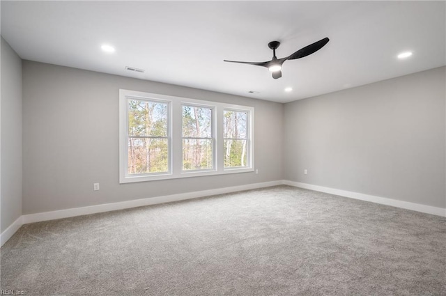 unfurnished room with a ceiling fan, carpet, baseboards, and recessed lighting