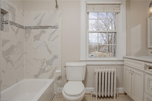 bathroom featuring vanity, radiator, baseboards, bathing tub / shower combination, and toilet