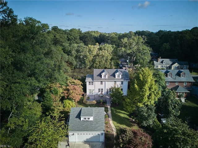 drone / aerial view featuring a view of trees