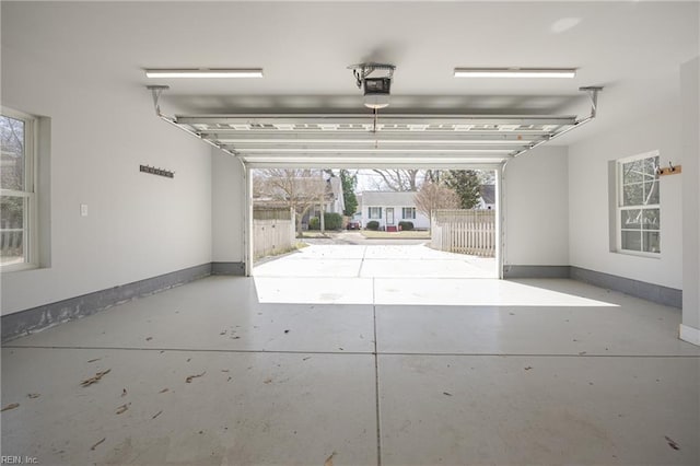 garage featuring baseboards and a garage door opener