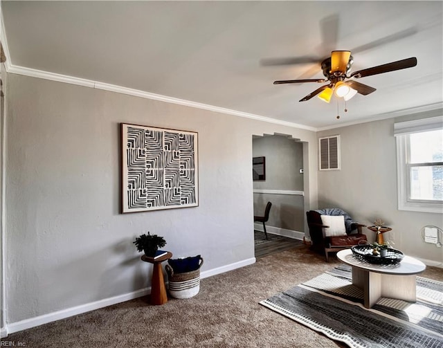 living room with baseboards, carpet, visible vents, and crown molding