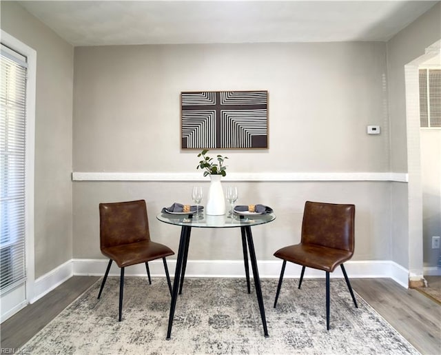 sitting room with wood finished floors and baseboards