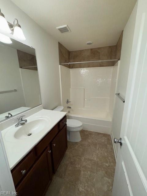 full bathroom with toilet,  shower combination, vanity, and visible vents