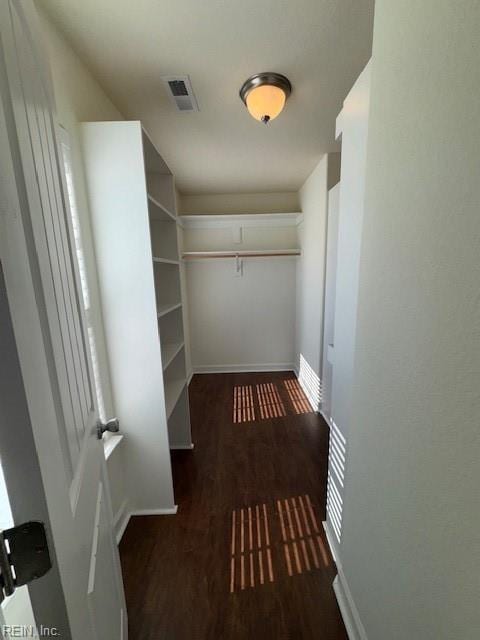 spacious closet with visible vents and wood finished floors