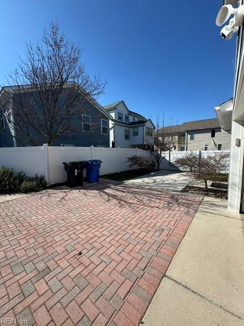 view of patio featuring fence