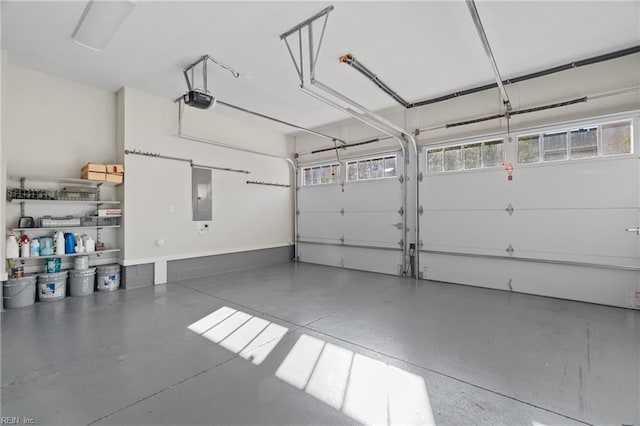 garage with electric panel and a garage door opener