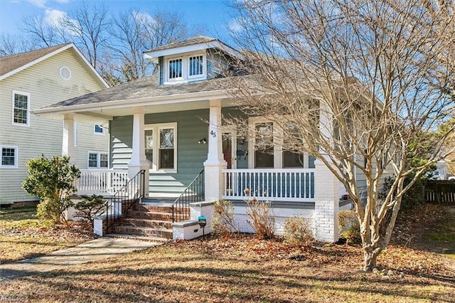 view of front of home featuring a porch and a shingled roof