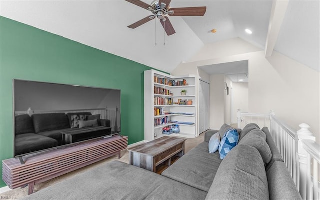 carpeted living area with vaulted ceiling and a ceiling fan