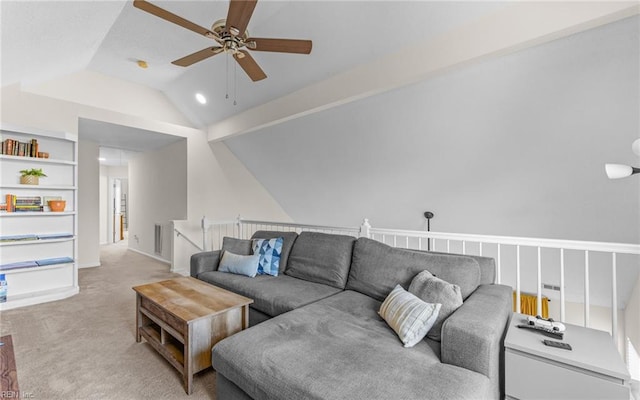 living area with a ceiling fan, lofted ceiling, light carpet, and visible vents