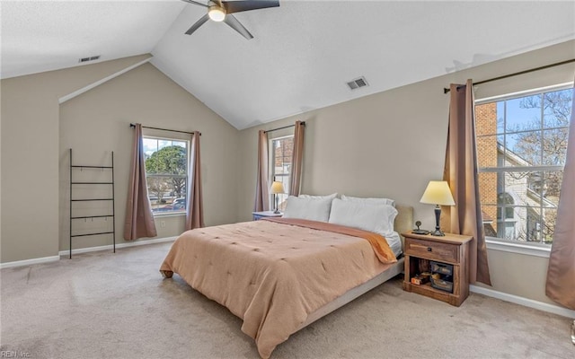 bedroom featuring visible vents, vaulted ceiling, and light colored carpet