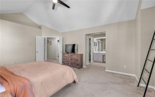 carpeted bedroom featuring vaulted ceiling, ceiling fan, ensuite bath, and baseboards