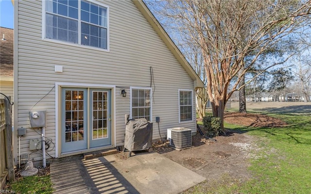 back of property featuring central AC and a patio area