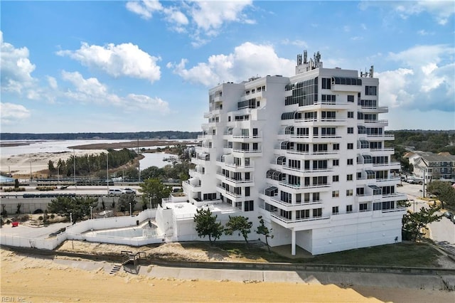 view of building exterior with a water view